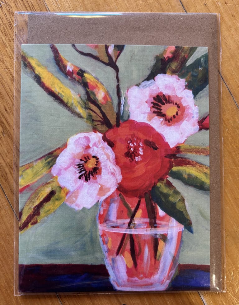 A small paper greeting card with Power Poppy Image printed on it. 