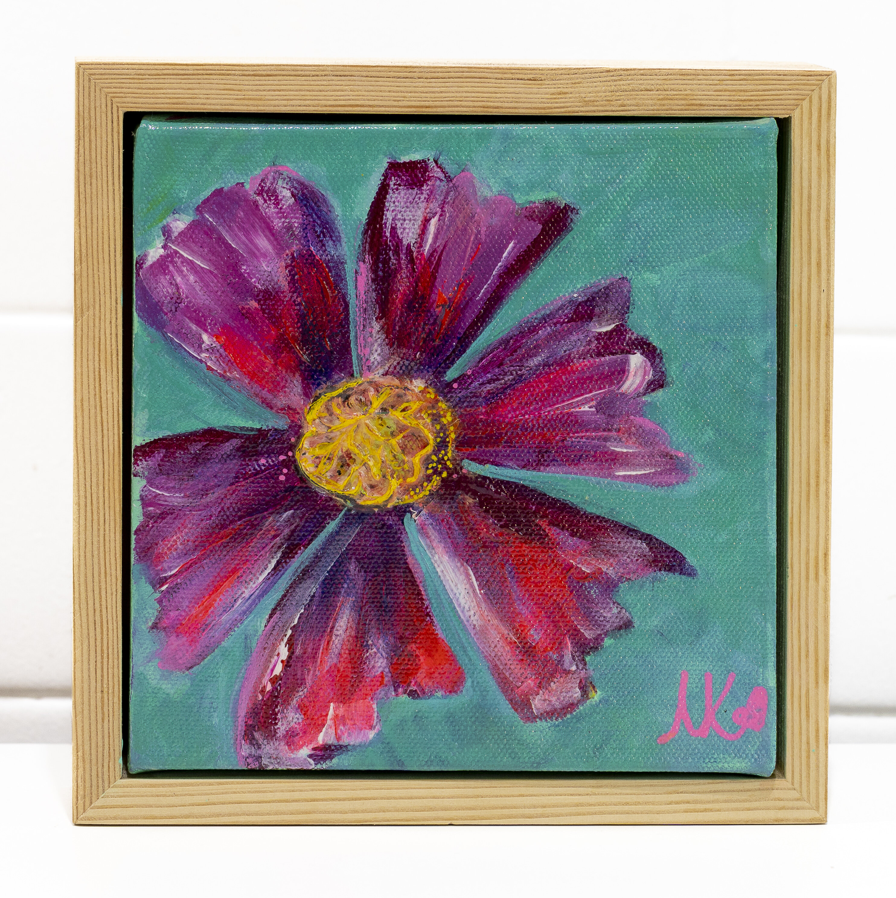 Close-up painting of a single purple and magenta dahlia flower with pointed petals and a yellow gold centre, against a teal green background.